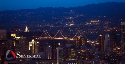 Overlooking a lit bridge in a city