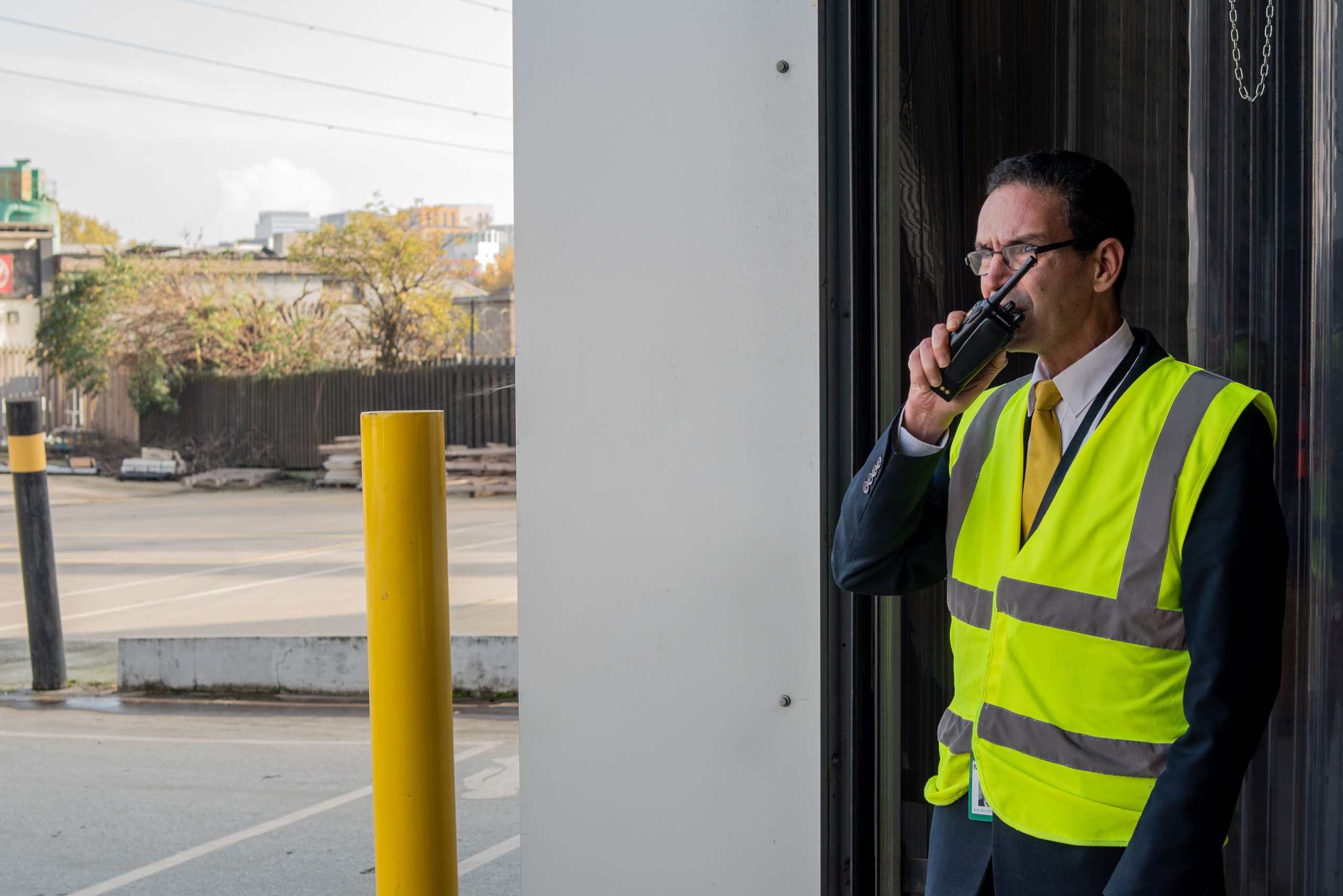 Security guard speaks in a walkie-talkie