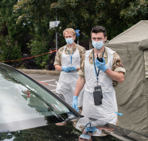 Two military reservists wearing protective gear against Covid-19