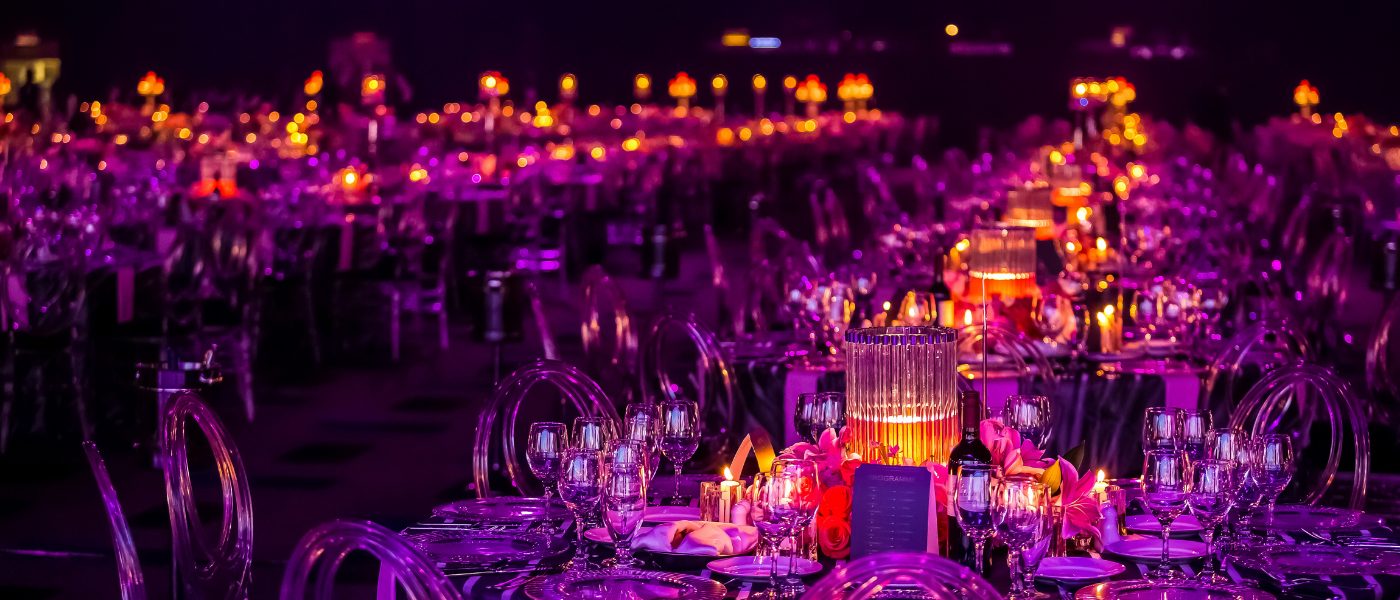 Tables set up for a special event with the lights off