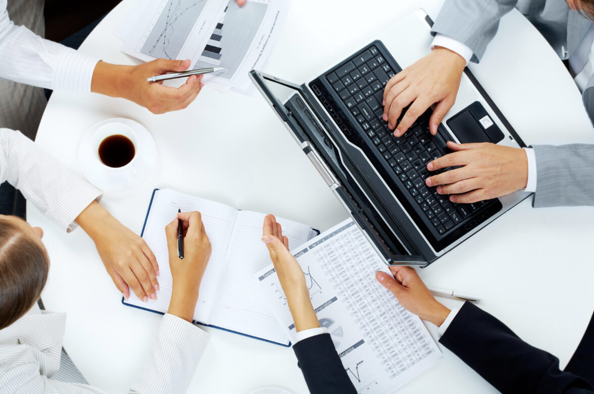 Group of business people working around a conference table