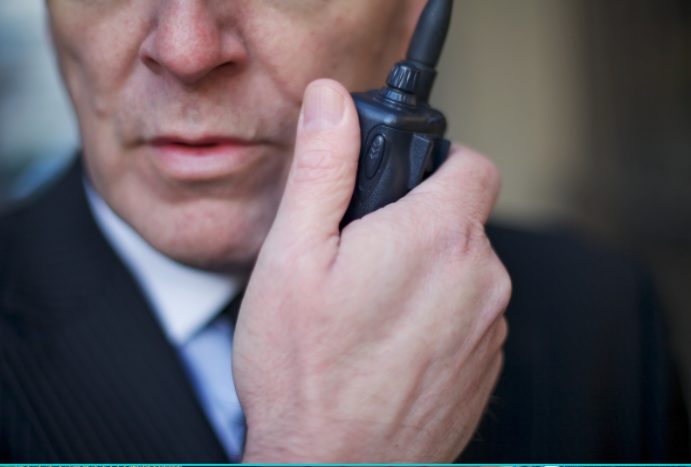 Security guard with a walkie-talkie