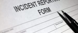 Incident Report Form and Pen